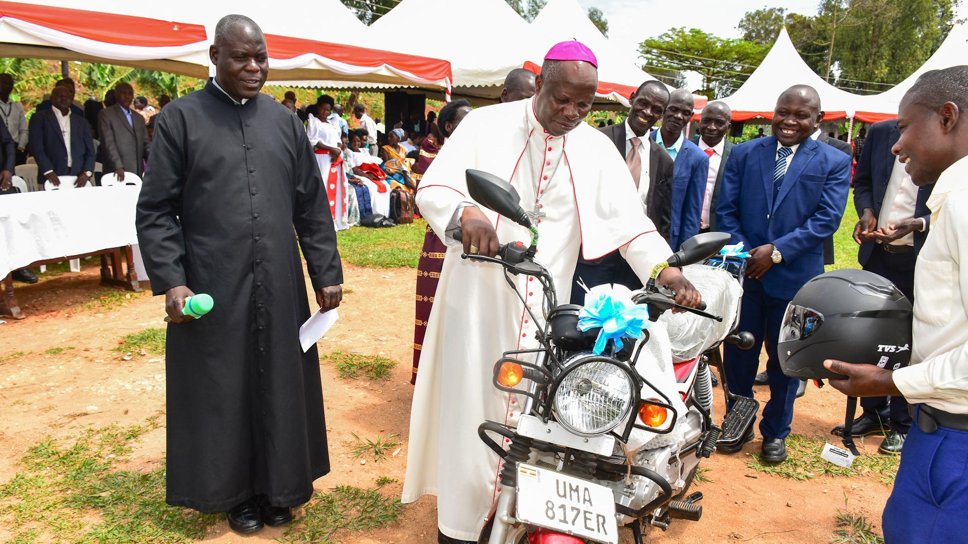 Bishop testing donated motor bike