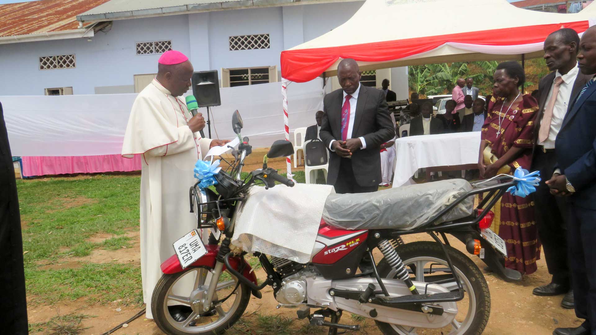 The Bishop announcing the bike recepient