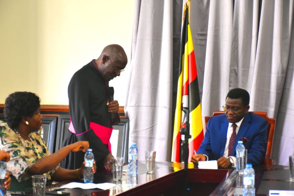 Msgr. George William Lubega delivering a message on behalf of Bishop Serverus Jjumba